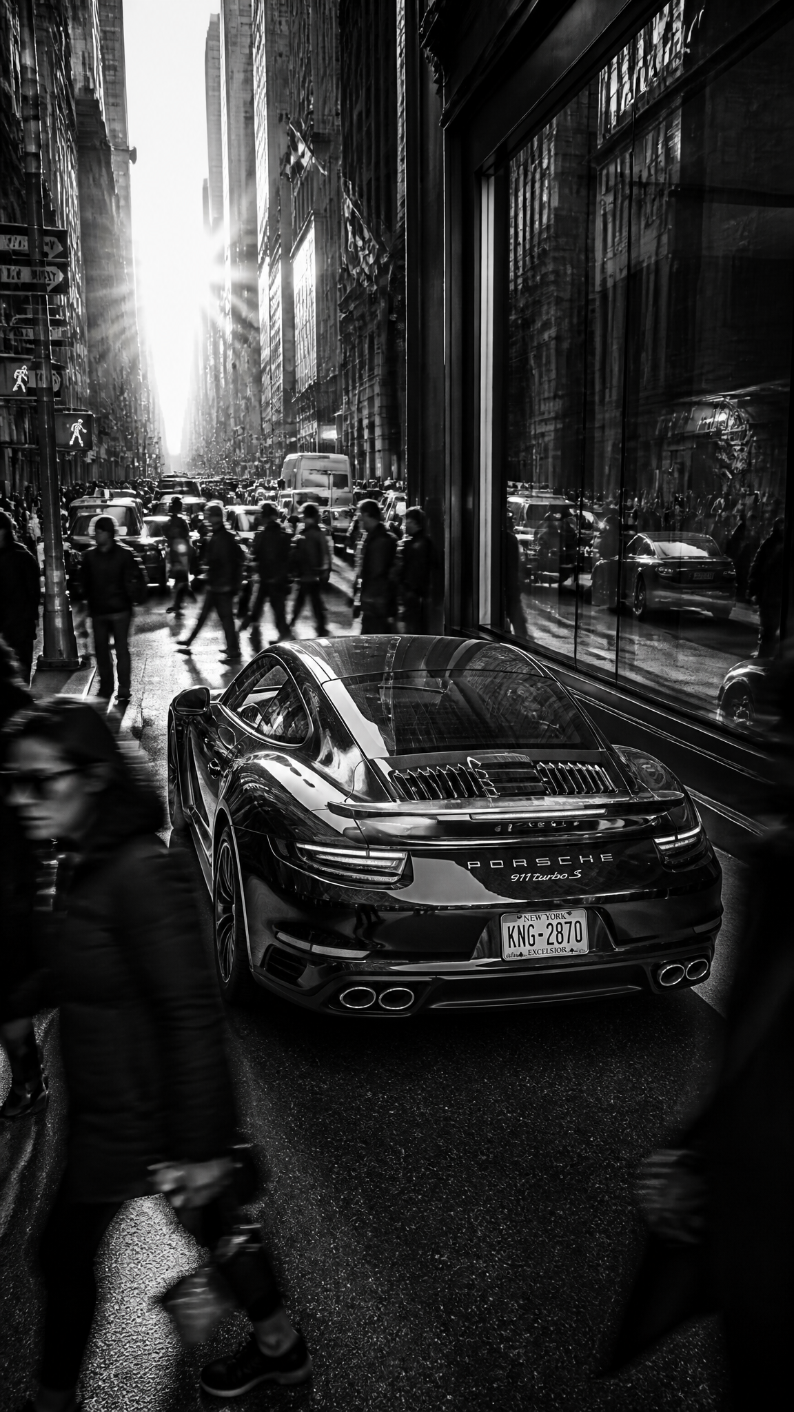 A stunning Porsche 911 parked confidently in the center o...